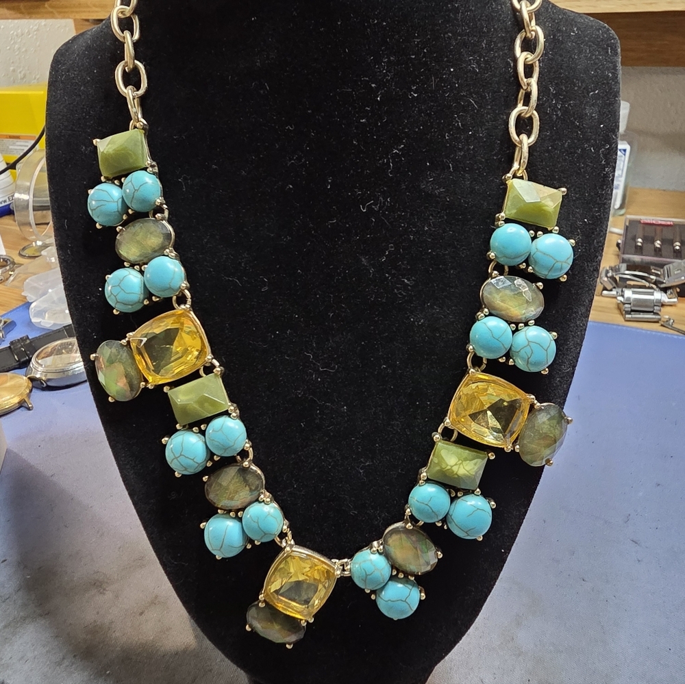 Chico's Norran Bib Necklace with green and blue simulated stones in a gold setti
